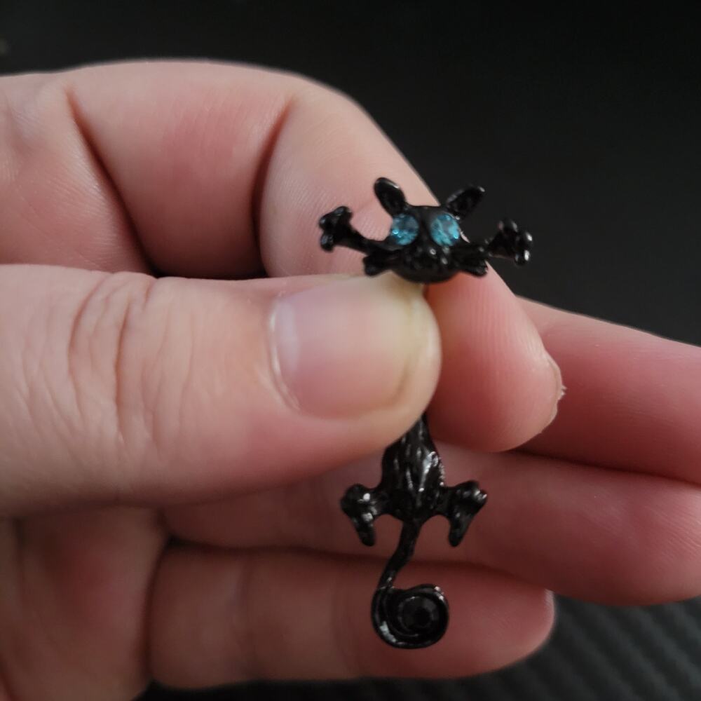 Black cat with blue eyes belly button navel piercing